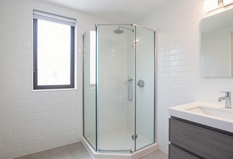 Small bathroom with glass walk-in shower and floating vanity