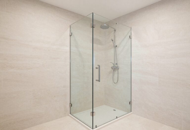 Modern walk-in shower with frameless glass and rainfall showerhead