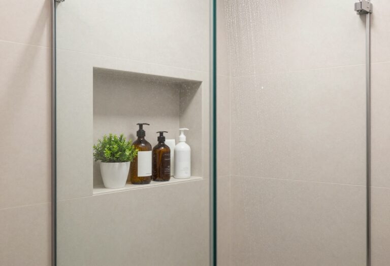 Modern shower with built-in shelf and toiletries
