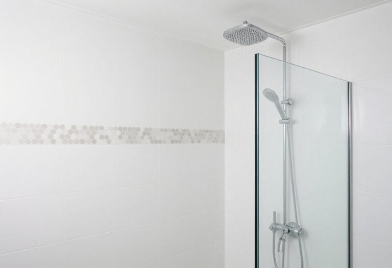 Modern bathroom shower with large white tiles and hexagon accent strip