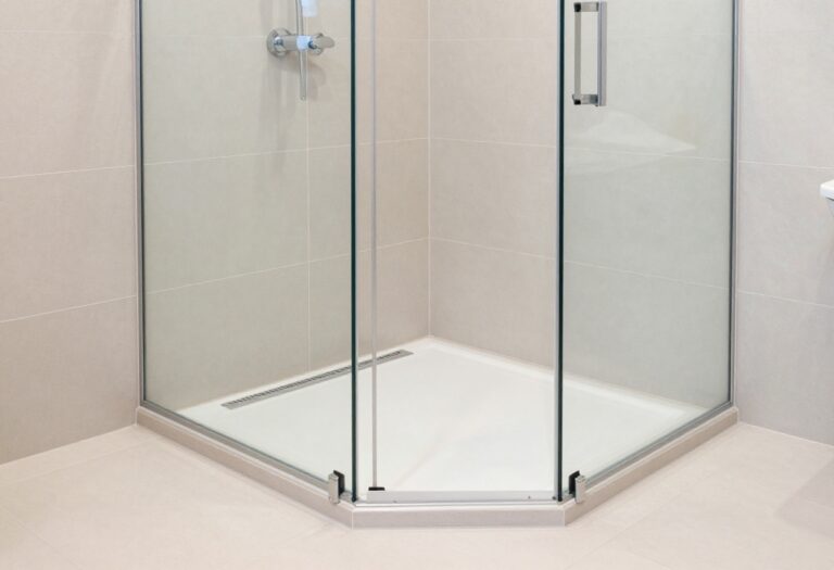 Modern shower base with linear drain and large tiles