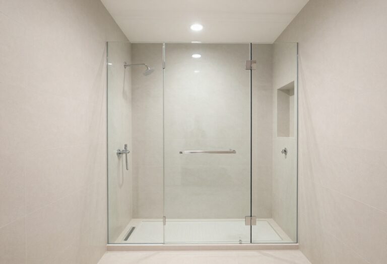 Modern master shower with frameless glass and rain showerhead
